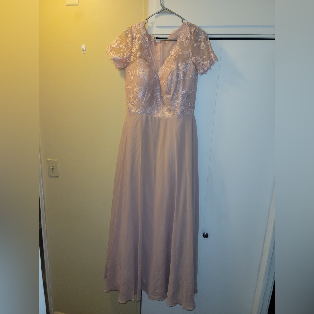 Light pink dress never worn due to finding a different one. Size 14.